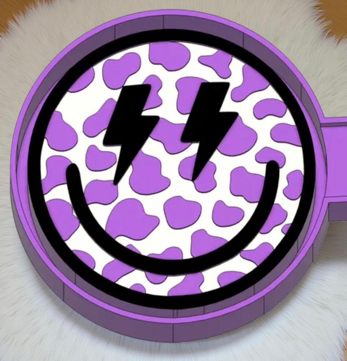 Cow print smiley face car freshie mold.