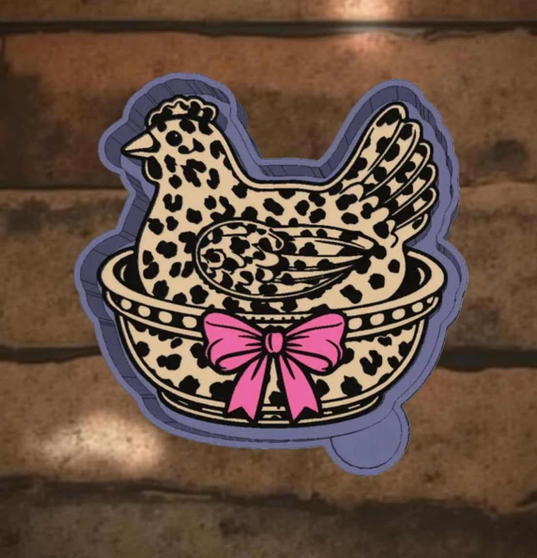 Cheetah print hen sitting on a nest car freshie.