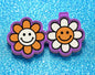 Smiley face flower vent clips.