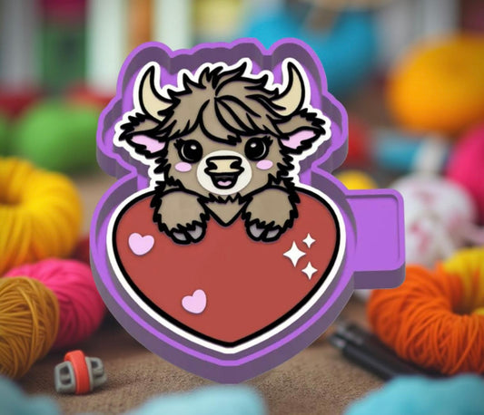 Highland cow sitting behind a heart.  Car freshie mold.